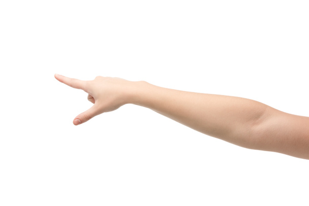 abgeschnittene Ansicht einer Frau, die mit dem Finger auf Weiß zeigt  - Foto, Bild