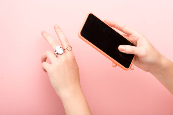 cropped view of woman showing peace and taking photo on pink background  - Φωτογραφία, εικόνα