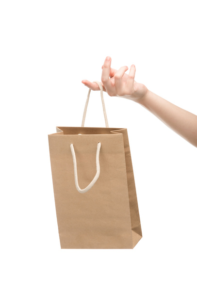 Ausgeschnittene Ansicht einer Frau mit Einkaufstasche auf weißem Grund  - Foto, Bild