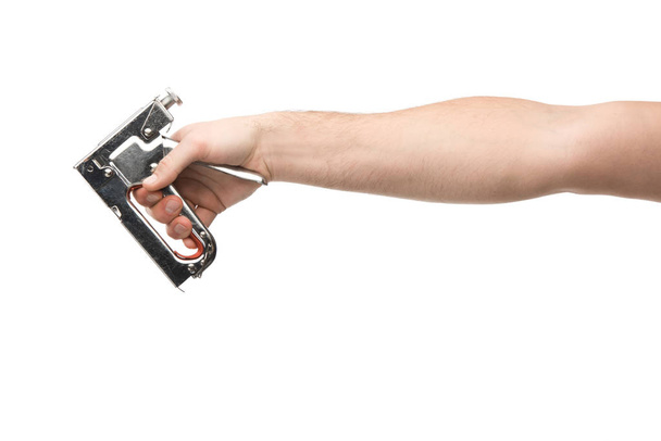 cropped view of man holding construction stapler isolated on white  - Φωτογραφία, εικόνα