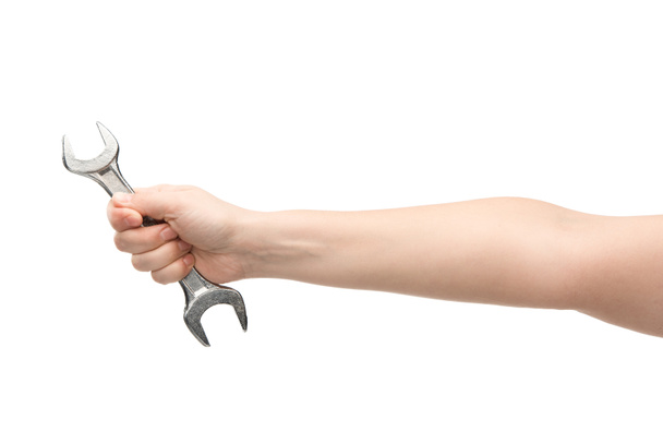 cropped view of woman holding spanner isolated on white  - Фото, зображення