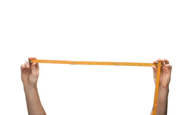 cropped view of man holding measuring tape isolated on white  - Zdjęcie, obraz