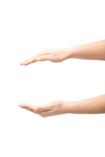 vista recortada de la mujer que muestra gesto de retención aislado en blanco
 - Foto, Imagen