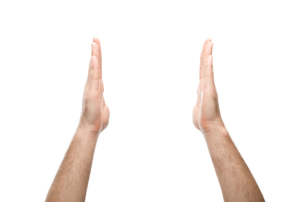 vista recortada del hombre mostrando gesto de retención aislado en blanco
 - Foto, imagen