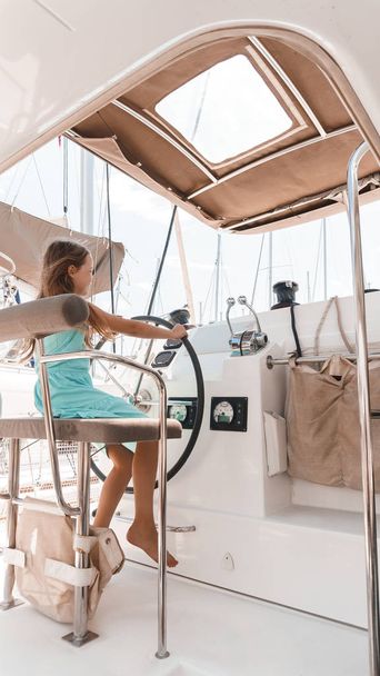 beautiful young girl in a yacht - 写真・画像
