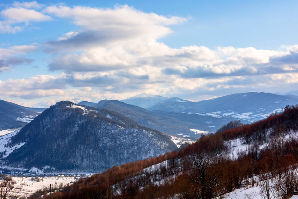 mountainous rural landscape on a sunny winter day - Фото, изображение
