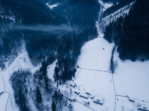 Winter village Kryvorivnia covered with snow in the Carpathians mountains, aerial view - Foto, Imagem