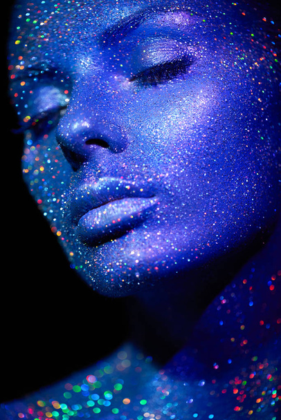 Portrait of beautiful woman with sparkles on her face - Fotó, kép