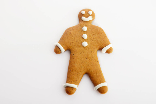 Man shaped gingerbread cookie isolated on a white background - Photo, Image