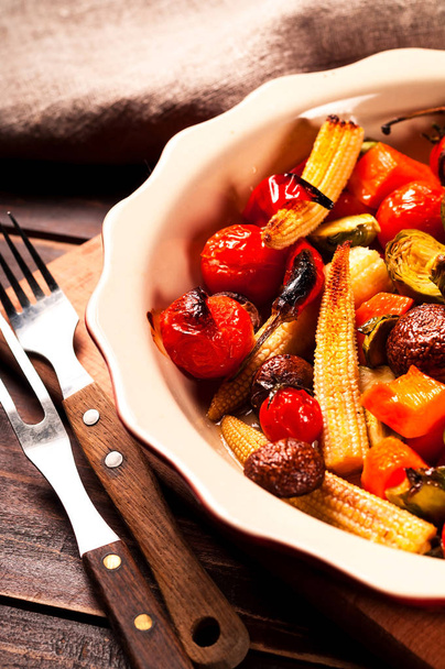 Spicy hot vegetables grilled in a ceramic bowl. Vegetable-mushroom blends. Close-up - Photo, Image