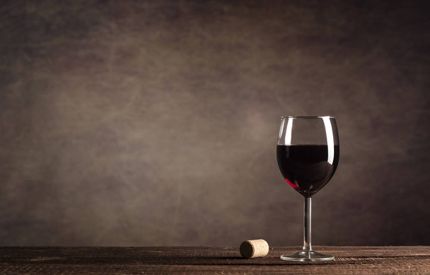 Red Wine in glass on a dark background with copy space - Zdjęcie, obraz