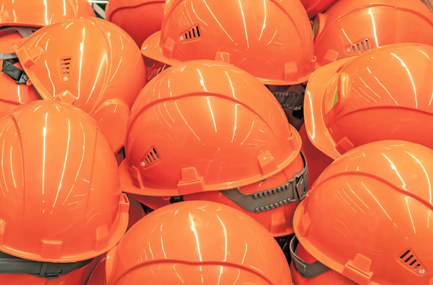 Orange safety helmets to protect the head in production and cons - Fotografie, Obrázek