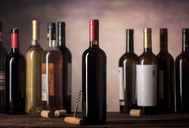 Wine bottles collection on a dark background - Photo, image