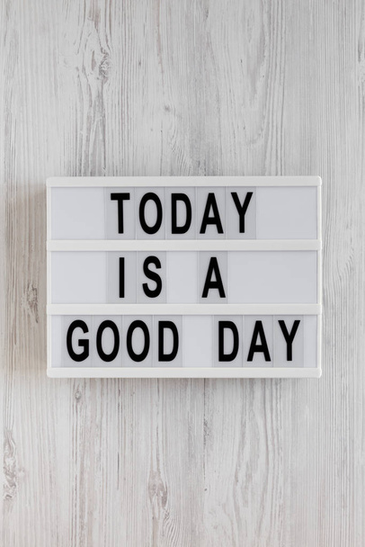 'Today is a good day' words on a lightbox on a white wooden back - Photo, Image