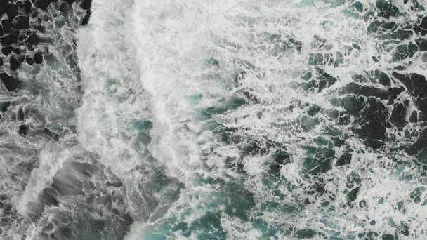 Aerial view. Very beautiful view of the Atlantic coast, aquamarine color of the waves falling on the beach of volcanic origin, Tenerife, Spain - Φωτογραφία, εικόνα