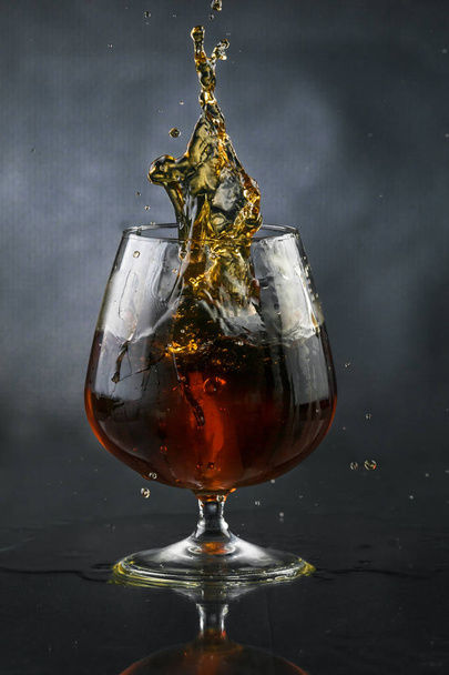 Spray in cognac glass - Φωτογραφία, εικόνα