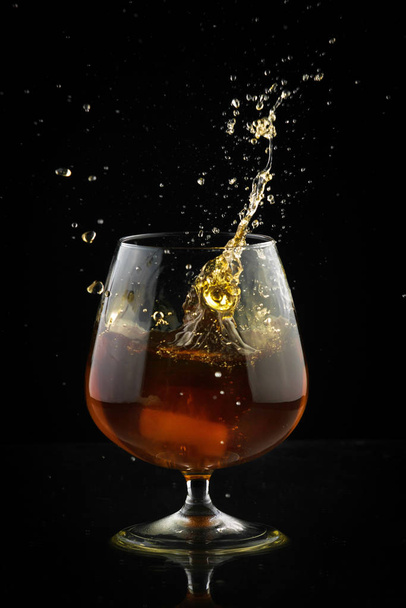Spray in cognac glass - Photo, Image