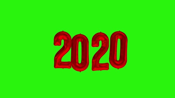 Yeni yıl 2020 kutlaması. Kırmızı folyo balonları yeşil zemin üzerinde 2020 numara - Video, Çekim