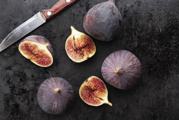 Fresh ripe figs on dark table. Top view - Fotó, kép