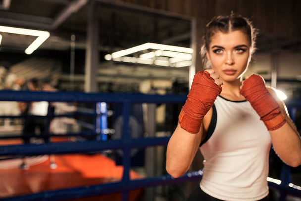 young fit female training, boxing in ring - Valokuva, kuva