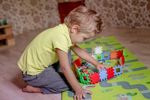 Kids Toys. Child Building Tower Of Toy Blocks. - Photo, Image