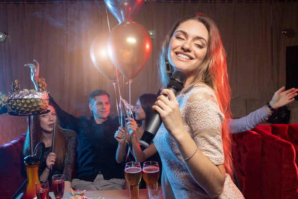 joyous female emotionally sing in karaoke - Foto, Imagem