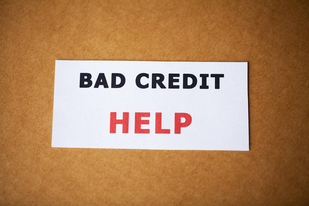 Bad credit, written on a white sheet of paper - Photo, Image
