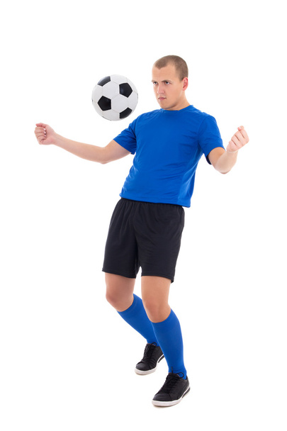 piłkarz na niebiesko zatrzymać piłkę z jego klatki piersiowej na w tle - Zdjęcie, obraz