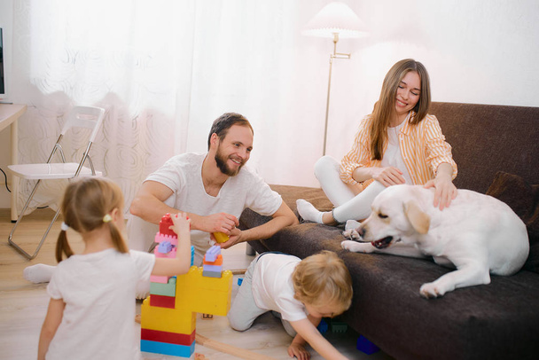 beautiful friendly family isolated in room - 写真・画像