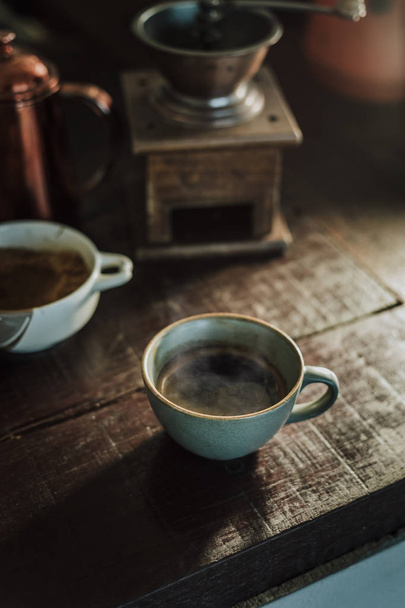 Cup of coffee americano on wood bar. - Zdjęcie, obraz