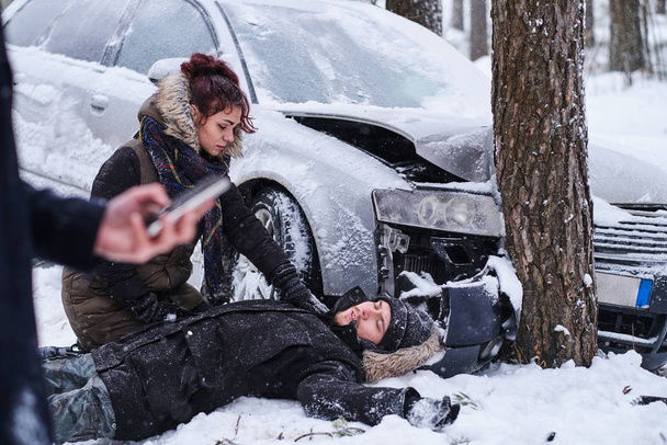 Car accident in winter vorest with one injured - Фото, изображение