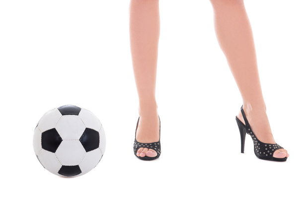 seksi kadın bacakları ve üzerinde beyaz izole futbol topu - Fotoğraf, Görsel