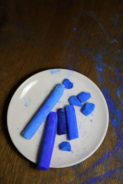 A few pieces of blue soft pastel chalk. Professional materials for Art. - Photo, image