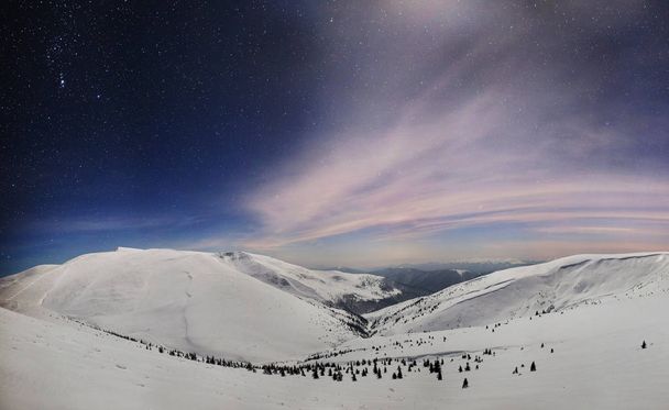 Panoramic night view of winter mountain valley covered with snow, mountains and moon - Fotoğraf, Görsel