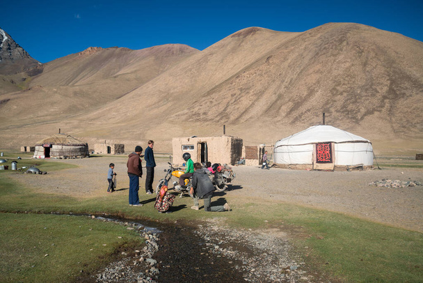 Pamir highway, Tajikistan, cicra august 2019: People in the Tajikistan village near Pamir highway - Zdjęcie, obraz