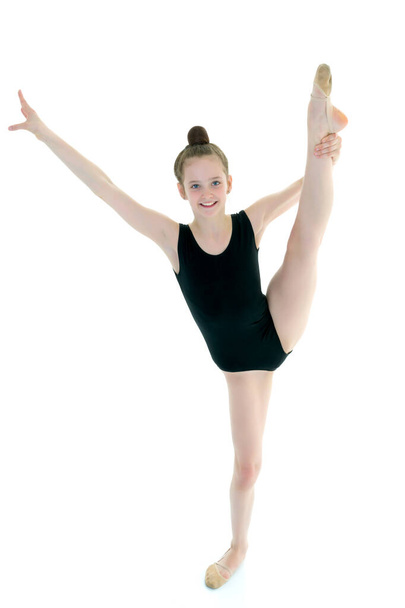 The gymnast perform an acrobatic element. - Фото, зображення