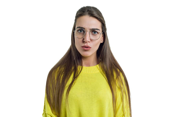 Young charming woman in glasses yellow clothes on white isolated background - Fotó, kép