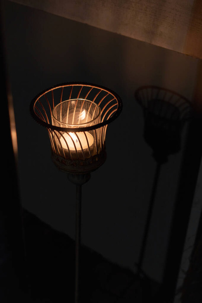 Candle light in basket with shadow - Photo, Image