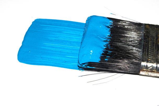 Blue Acrylic Paint Stroke with Paint Brush on White Background - Фото, изображение