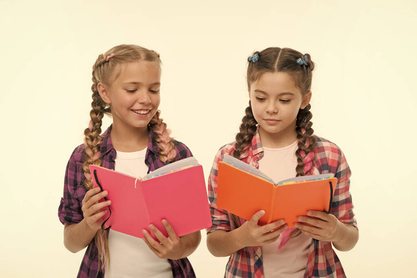 Education concept. Cute small children holding books. Adorable little girls with school exercise books. Preparing activity books for writing. Reading skills. Study language. Achieve knowledge - Φωτογραφία, εικόνα