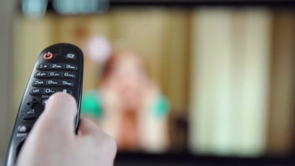 Choose a TV channel using the buttons on the TV remote control - Footage, Video