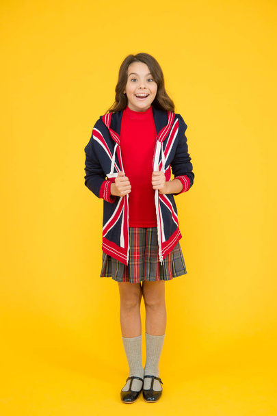 Do you speak english. go study to england. learn english language. british school in england. vacation in great britain. travel. Union Jack Flag. small girl uniform. kid with english flag on jacket - Foto, immagini