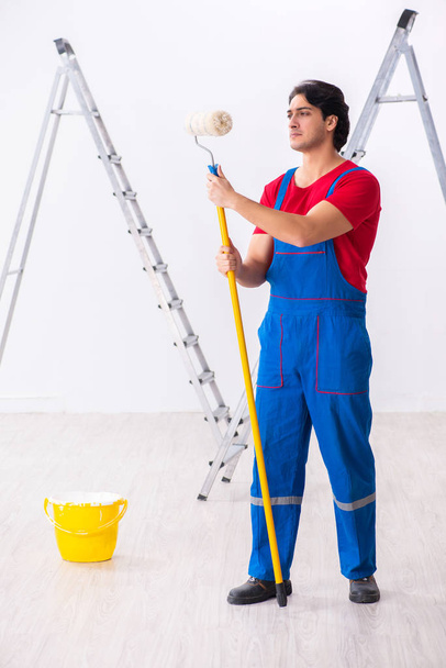 Young handsome contractor working indoors - Photo, Image