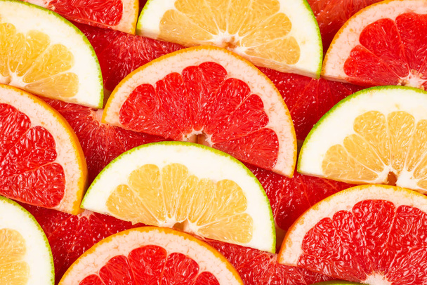 Pomelo és grapefruit szeletek háttér.  - Fotó, kép