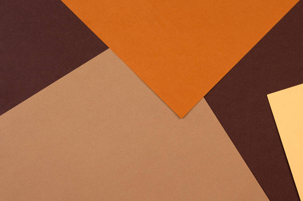 Abstract geometric paper background in earth tone. Many earth tones originate from clay earth pigments, such as umber, ochre, and sienna. - Photo, Image