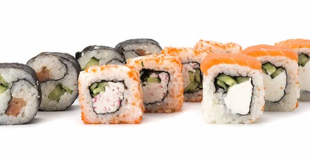three kinds of sushi rolls white background. Japanese cuisine - Фото, зображення