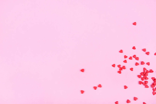 Pink background with red hearts. Valentine's day concept. - Φωτογραφία, εικόνα