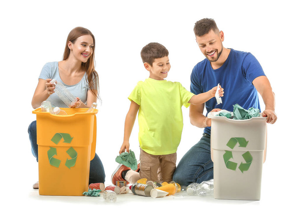 Family with containers for garbage on white background. Concept of recycling - Фото, изображение