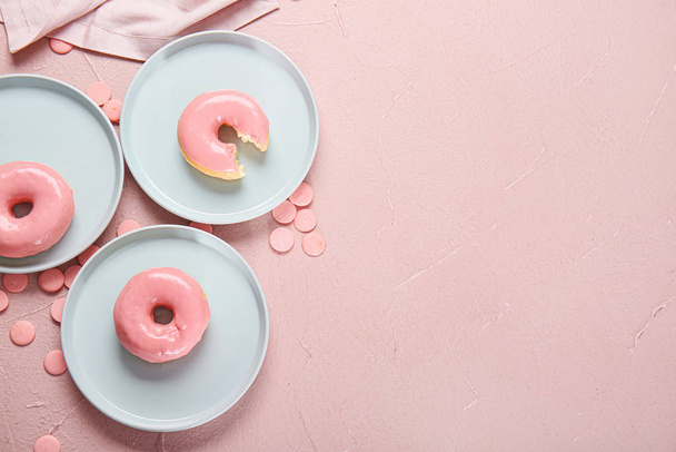 Sweet tasty donuts on color background - Photo, image