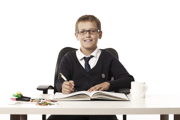 boy writes in a notebook - Φωτογραφία, εικόνα